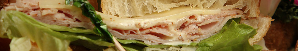Eating Sandwich Cafe at Cape Cod Bagel Cafe restaurant in Falmouth, MA.